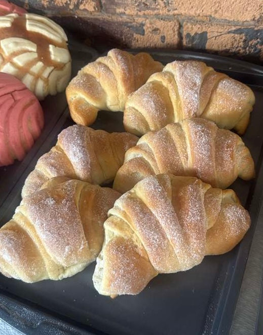 Bigotes (mustache shape bread cinnamon and sugar coated)